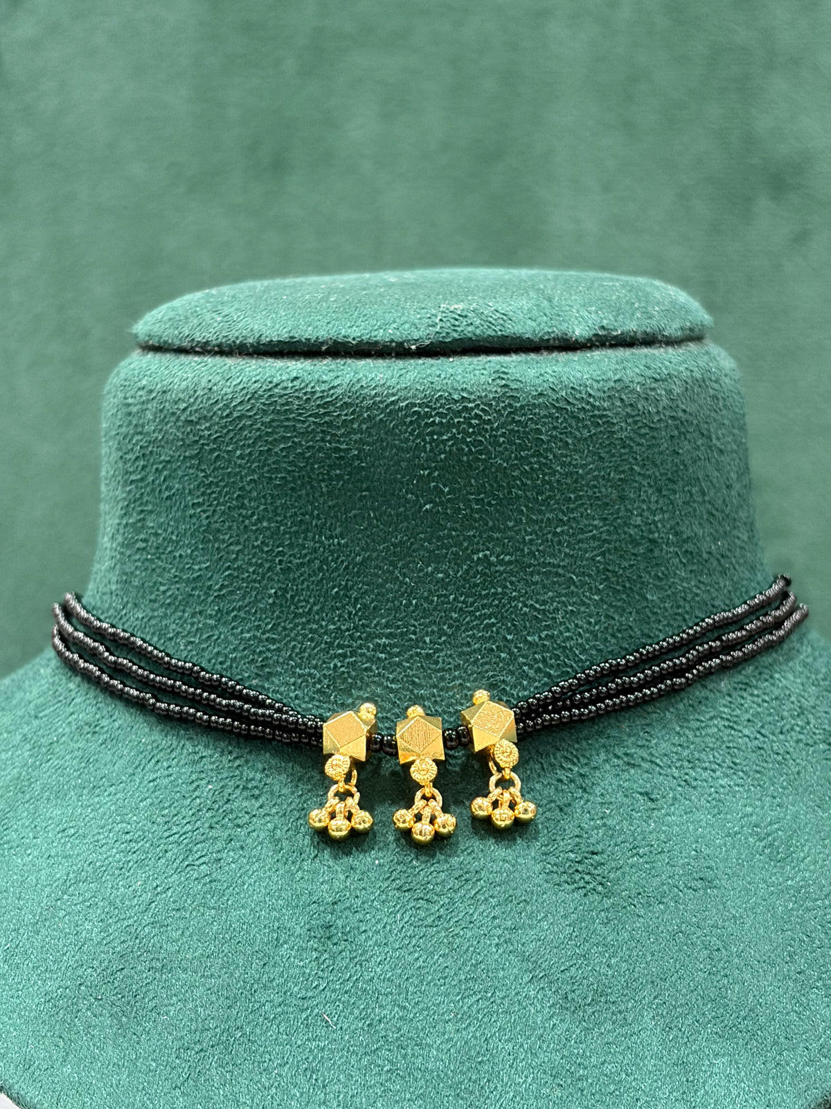Traditional Black Beaded Necklace with Gold Geometric Pendants