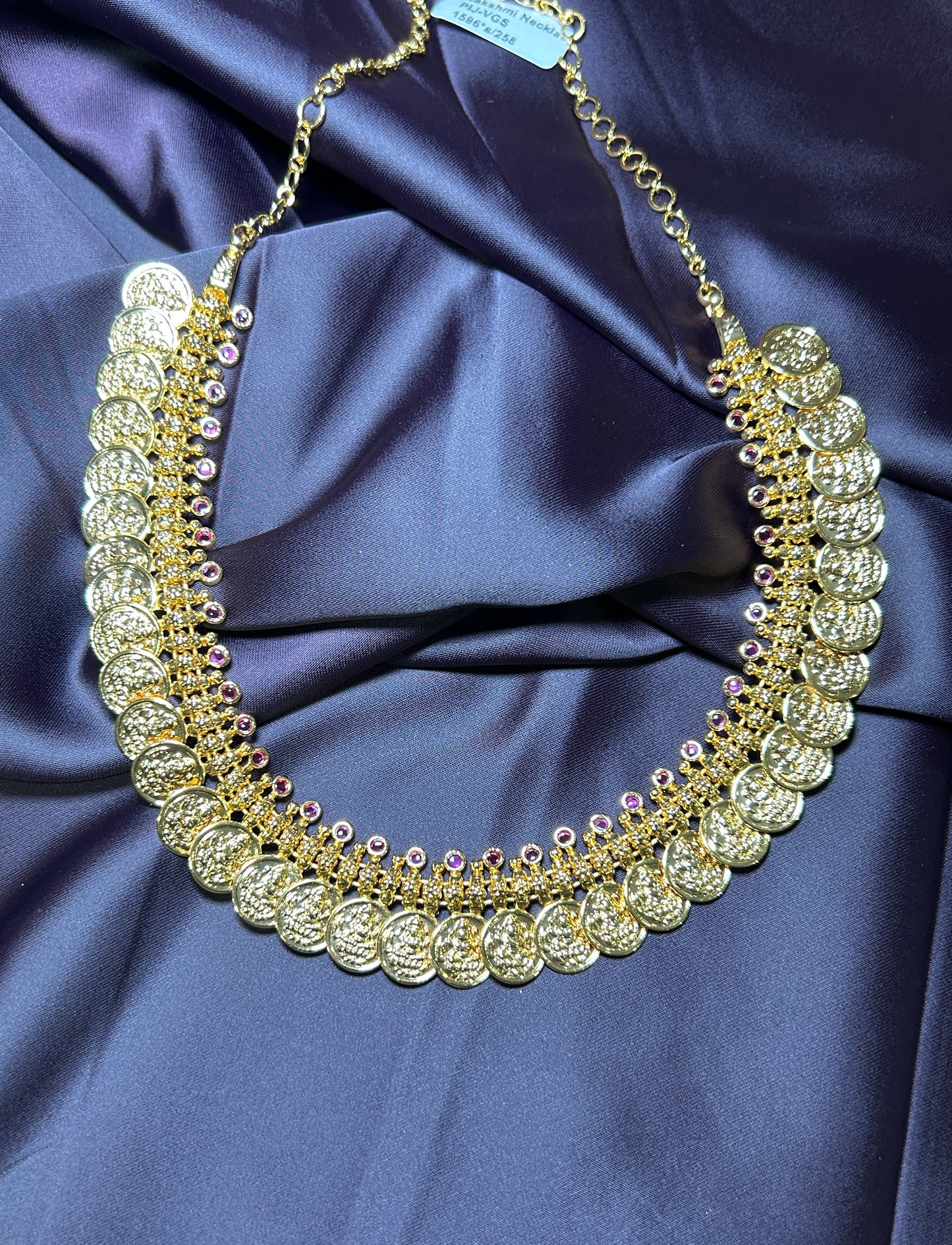Grand Coin Haar with Purple Stone Accents
