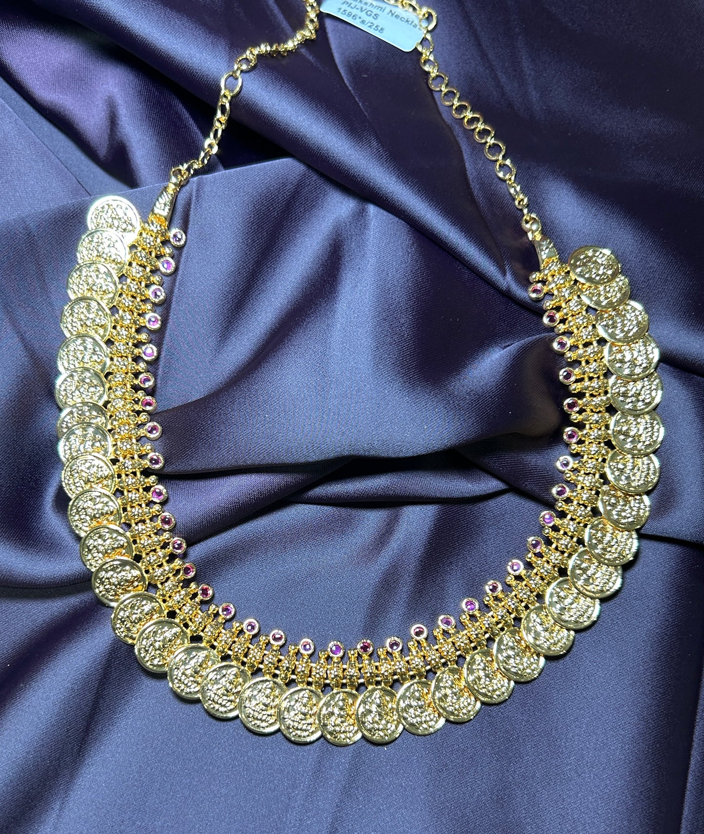 Grand Coin Haar with Purple Stone Accents