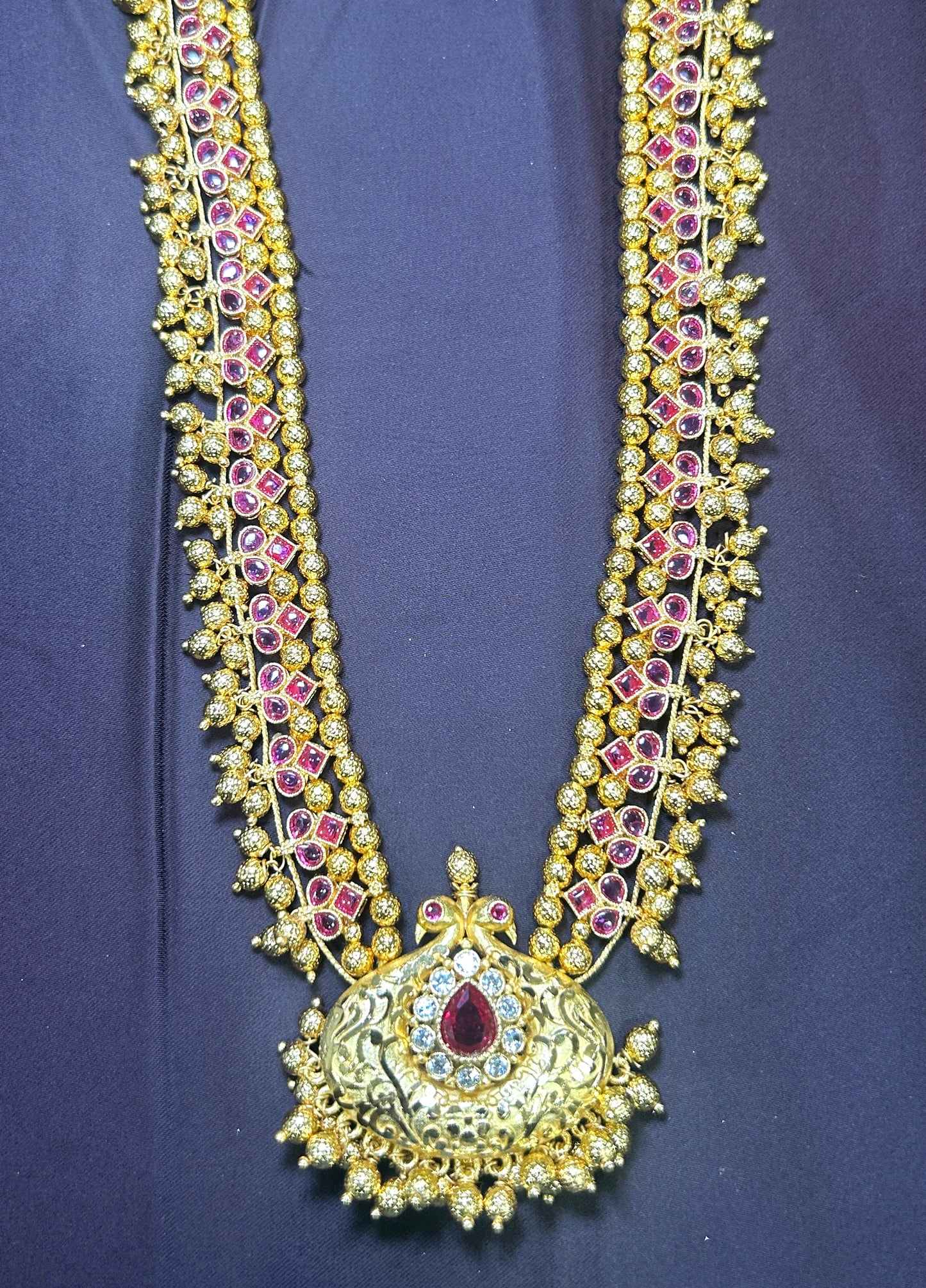 Ruby Temple-Style Haar with Ornate Central Pendant