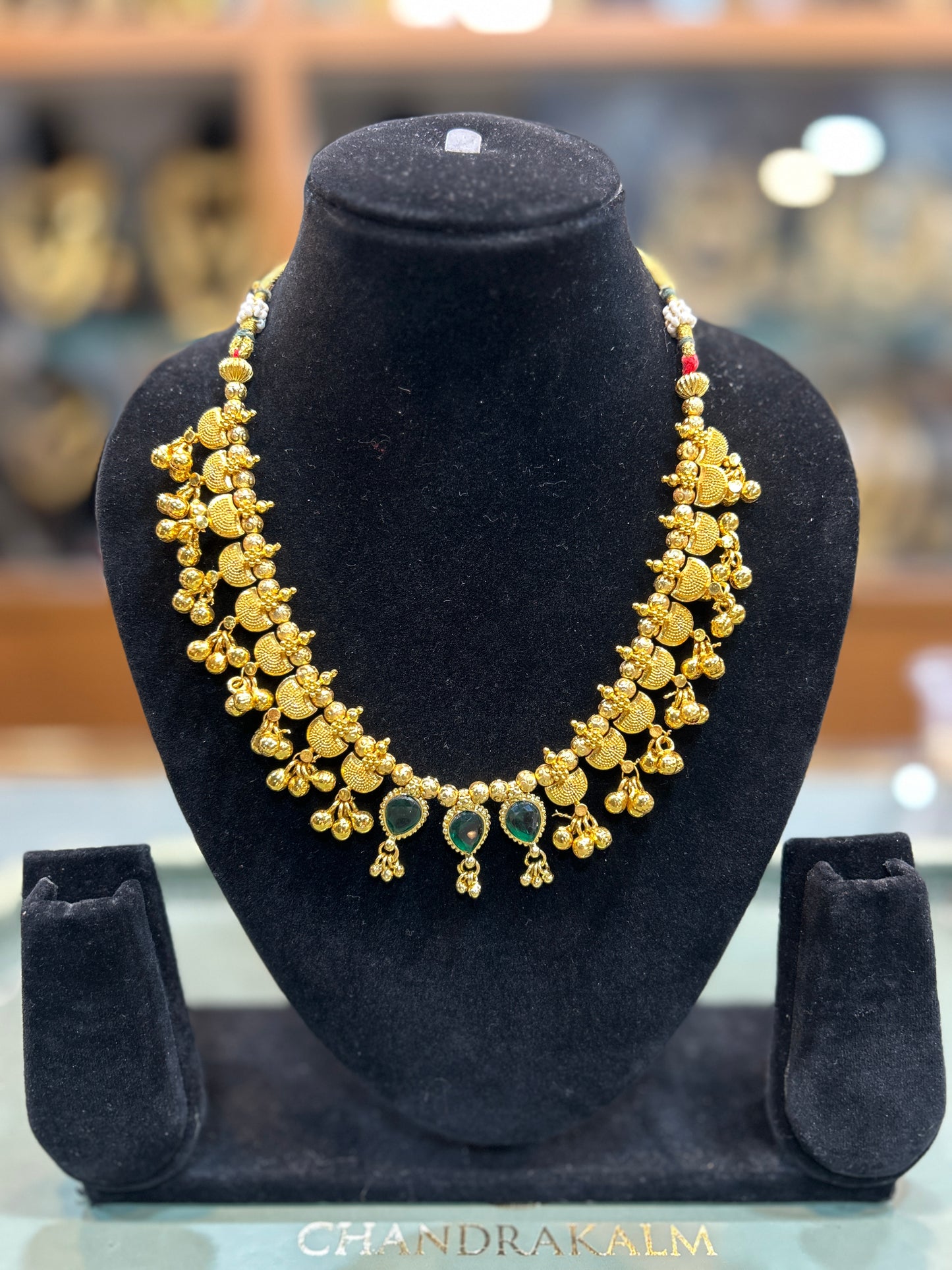 Classic Gold-Finish Temple Necklace with Green Stone Accents