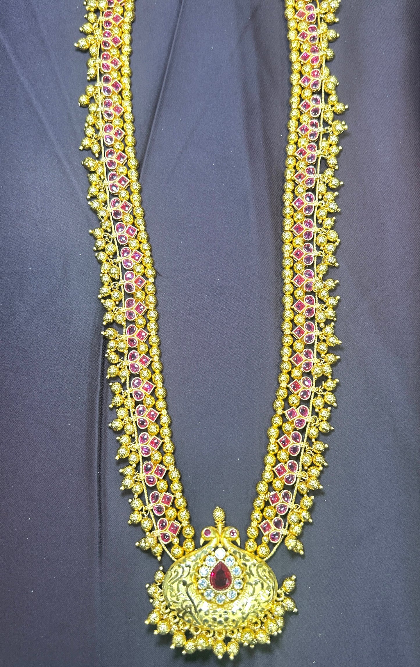Ruby Temple-Style Haar with Ornate Central Pendant