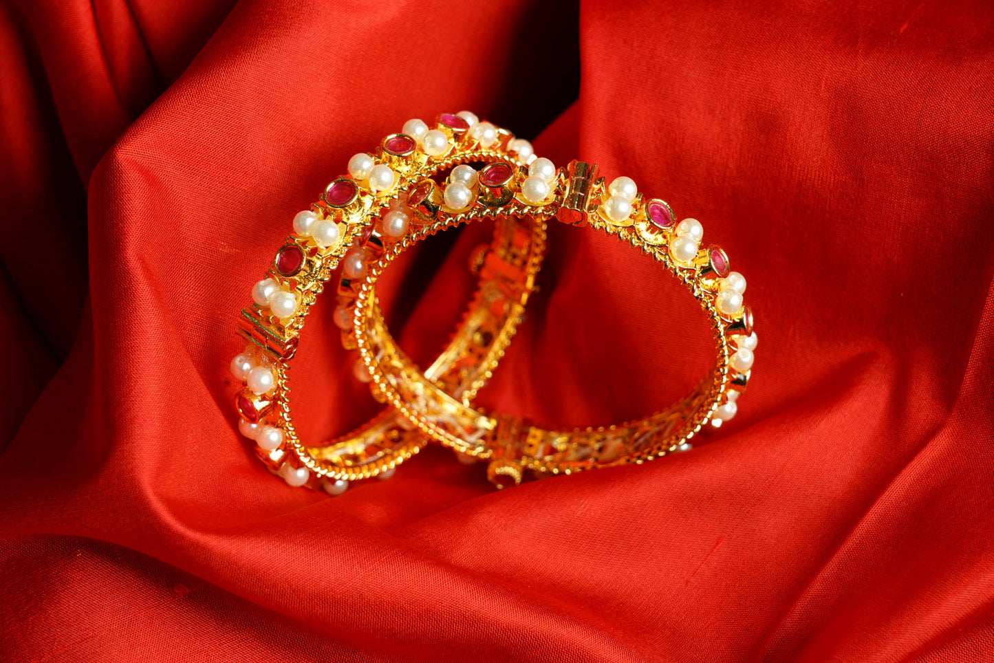 Pearl bangles in pink stone