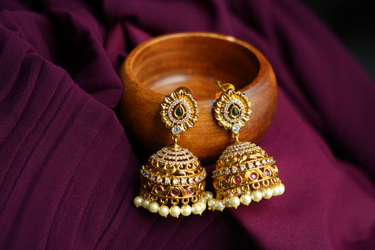 Traditional Gold Jhumka Earrings with Pearl Detailing